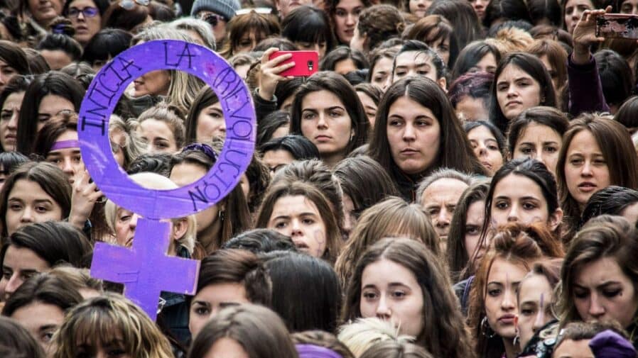 A sign reads "INCIA LA REVOLUTION" (Start the revolution) at the Women's strike in Pamplona, Spain on 8 March 2018.