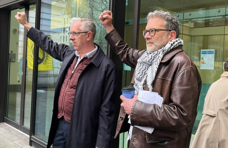 Chris Nineham and Ben Jamal of the PSC outside the courthouse