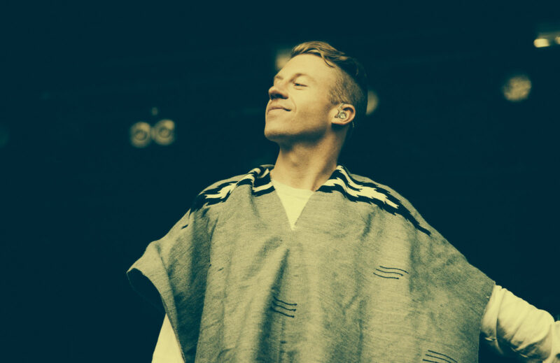 Macklemore performing on stage
