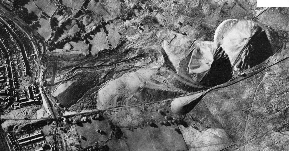 Aerial view of the collapsed coal spoil tip above Aberfan and the landslide route into the village after the 1966 disaster.