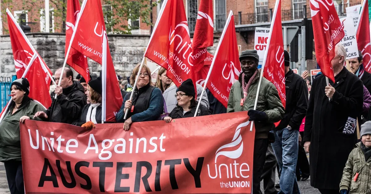 Trade unionists carrying Unite flags and a banner at a Dublin anti-austerity protest in 2012; archive photo.