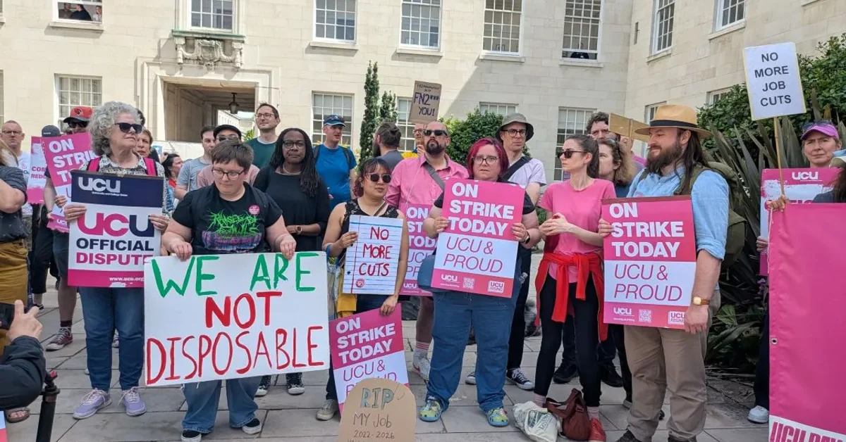University of Nottingham staff and students protesting cuts, holding UCU placards and a banner reading We Are Not Disposable.