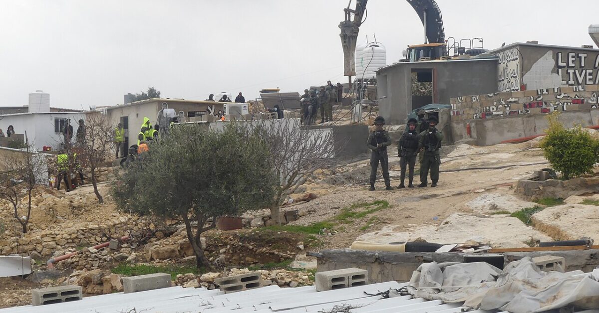 An Israeli excavator and soldiers at a Palestinian home demolition in Khallet Athaba, occupied West Bank, 10 February 2025
